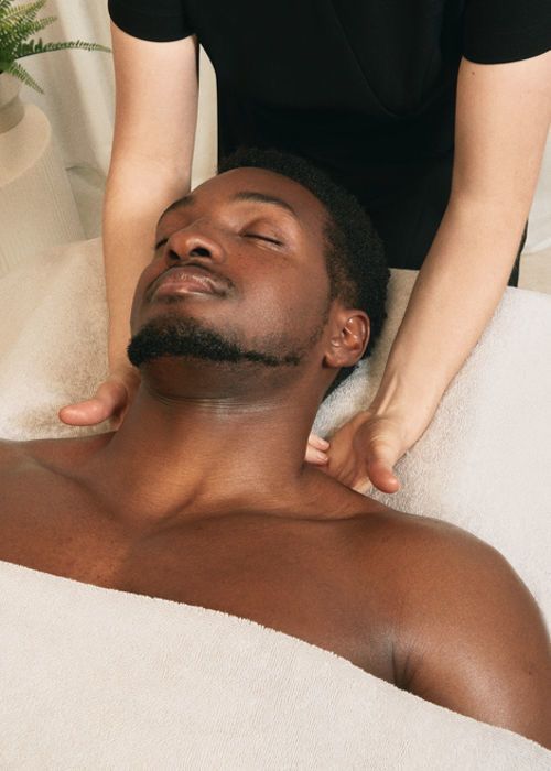Therapist performing a relaxing neck massage